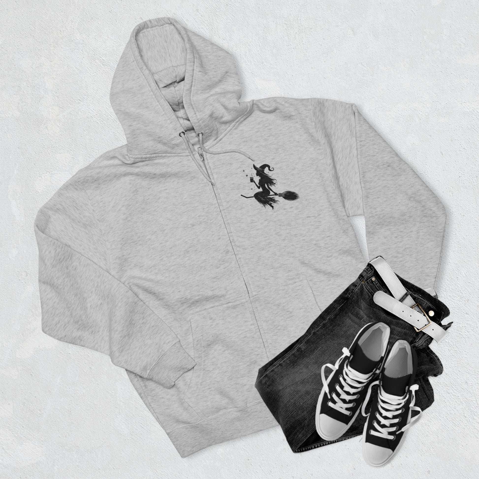 Hoodie: featuring a witch flying with a coffee cup, with a moon in the background. Gray color Hoodie with Black graphics on the front chest,  and back.
