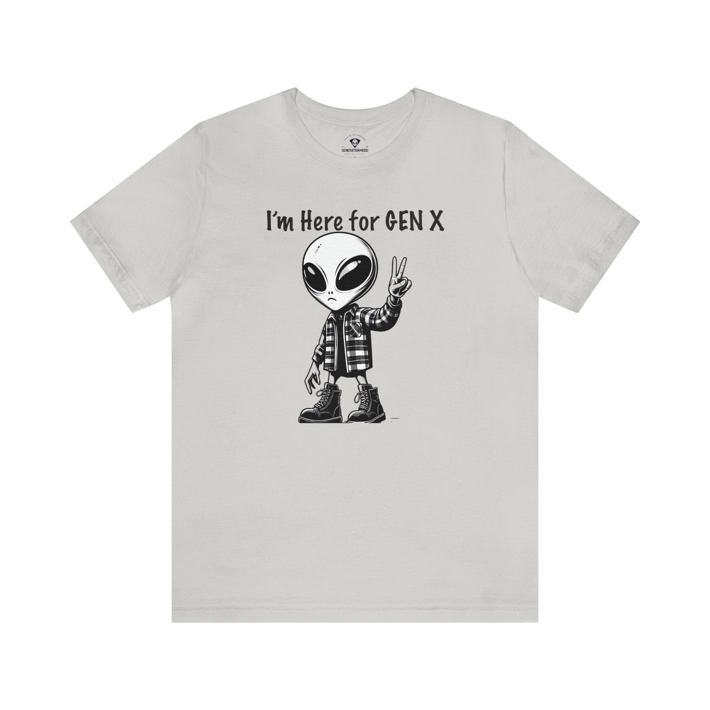 Are you a proud member of Generation X, the generation that grew up with minimal adult supervision? Do you identify with the grunge music scene, the critical thinking attitude, and the enterprising spirit of your peers? If so, you might like this T-shirt that features an alien with combat boots and a flannel shirt, flashing a peace sign, saying “I’m here for Gen X”.