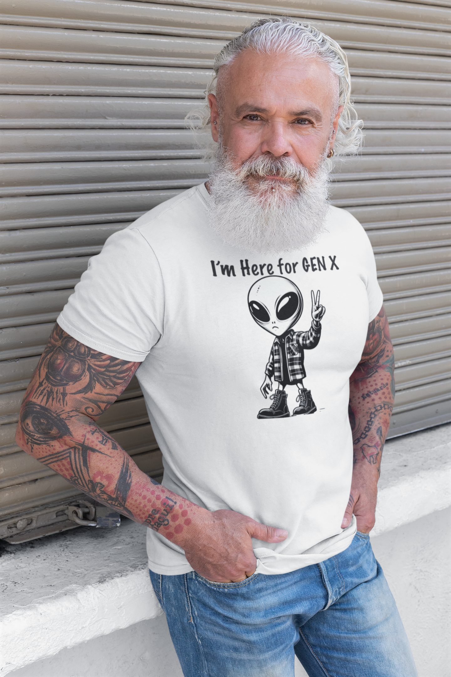 Are you a proud member of Generation X, the generation that grew up with minimal adult supervision? Do you identify with the grunge music scene, the critical thinking attitude, and the enterprising spirit of your peers? If so, you might like this T-shirt that features an alien with combat boots and a flannel shirt, flashing a peace sign, saying “I’m here for Gen X”. 